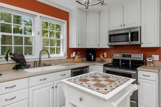 935 Glenwood Blvd, Waynesboro, VA 22980 - kitchen featuring appliances with stainless steel finishes, light countertops, white cabinets, a center island, and a chandelier