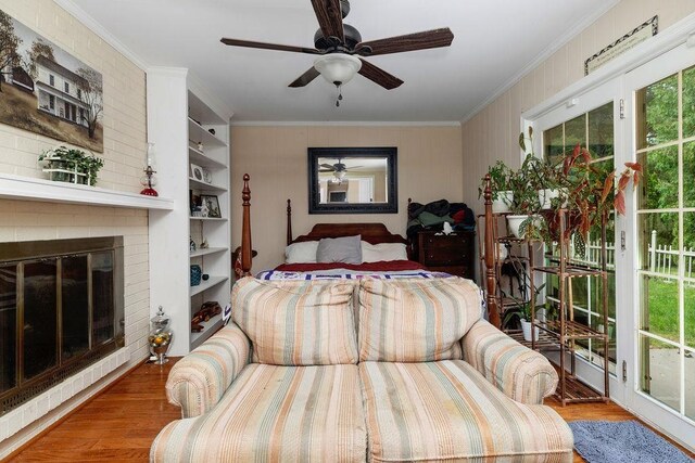 935 Glenwood Blvd, Waynesboro, VA 22980 - bedroom featuring wood finished floors, crown molding, a fireplace, and ceiling fan