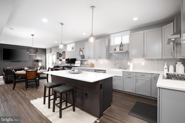 11405 Owls Nest Ct, Spotsylvania, VA 22551 - kitchen featuring open shelves, a sink, tasteful backsplash, light countertops, and a kitchen island