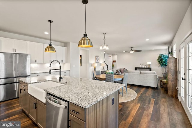 11405 Owls Nest Ct, Spotsylvania, VA 22551 - kitchen with appliances with stainless steel finishes, a sink, ceiling fan, dark wood-style flooring, and tasteful backsplash