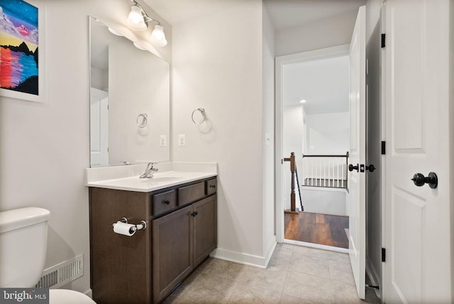 11405 Owls Nest Ct, Spotsylvania, VA 22551 - bathroom with vanity, toilet, tile patterned flooring, and baseboards