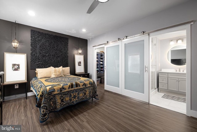 11405 Owls Nest Ct, Spotsylvania, VA 22551 - bedroom with a sink, a walk in closet, wood finished floors, a closet, and recessed lighting