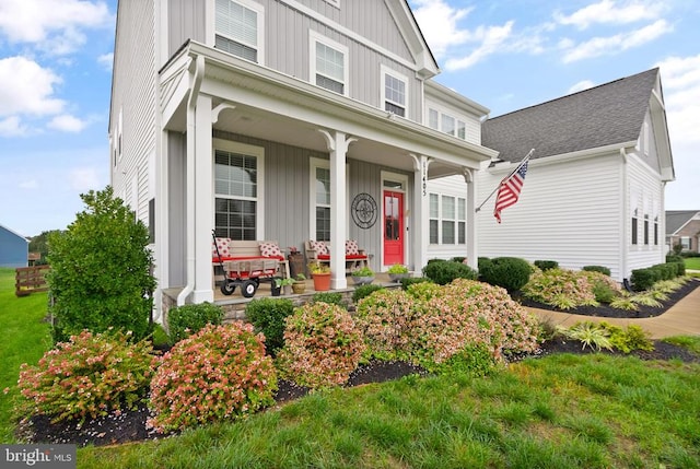 11405 Owls Nest Ct, Spotsylvania, VA 22551 - view of front of house with covered porch, board and batten siding, and roof with shingles