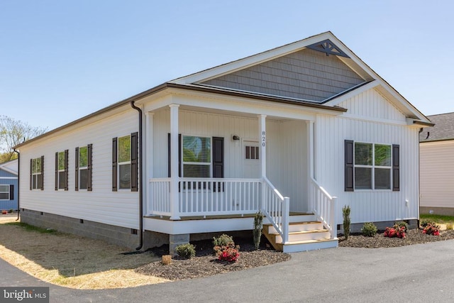 view of front of home featuring covered porch and crawl space