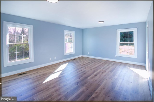 19196 Ferguson Ln, Jeffersonton, VA 22724 - spare room featuring wood finished floors, visible vents, and baseboards