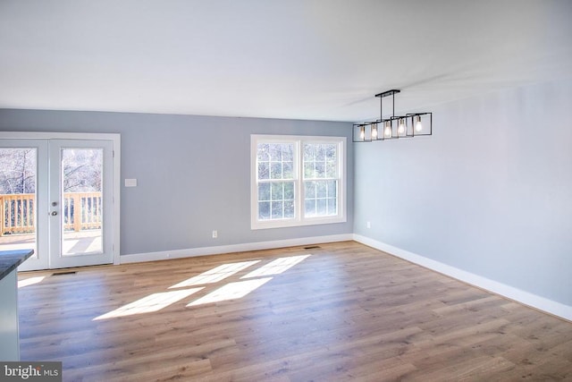 19196 Ferguson Ln, Jeffersonton, VA 22724 - unfurnished dining area featuring baseboards, an inviting chandelier, french doors, and wood finished floors