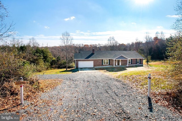 19196 Ferguson Ln, Jeffersonton, VA 22724 - ranch-style home featuring a garage, a chimney, and gravel driveway