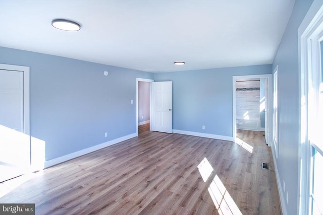 19196 Ferguson Ln, Jeffersonton, VA 22724 - unfurnished bedroom with baseboards, visible vents, and wood finished floors