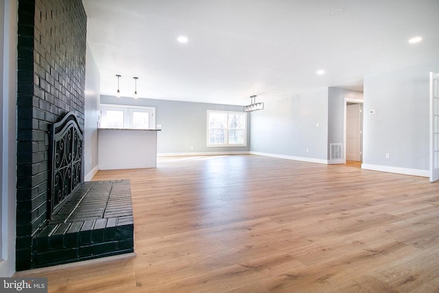 19196 Ferguson Ln, Jeffersonton, VA 22724 - unfurnished living room with baseboards, visible vents, and plenty of natural light