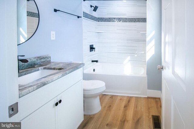 19196 Ferguson Ln, Jeffersonton, VA 22724 - full bathroom with shower / bathing tub combination, toilet, wood finished floors, vanity, and visible vents