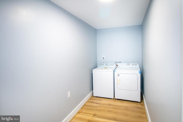 19196 Ferguson Ln, Jeffersonton, VA 22724 - washroom with washer and dryer, laundry area, light wood-type flooring, and baseboards