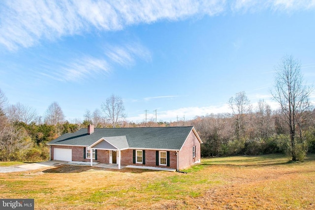 19196 Ferguson Ln, Jeffersonton, VA 22724 - single story home featuring a porch, brick siding, concrete driveway, a garage, and a front yard