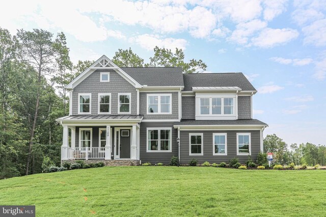 craftsman house featuring a porch and a front yard