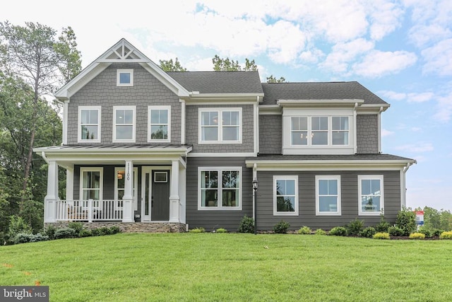 view of front of property featuring a porch and a front lawn