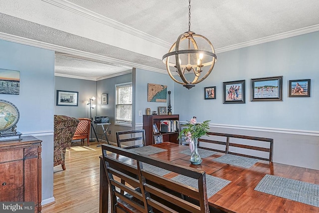 119 Birchside Cir, Locust Grove, VA 22508 - dining space featuring a textured ceiling, a chandelier, light wood finished floors, and ornamental molding