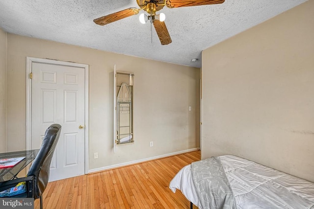 119 Birchside Cir, Locust Grove, VA 22508 - bedroom with a textured ceiling, wood finished floors, baseboards, and ceiling fan