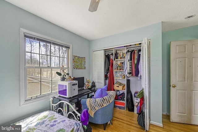 119 Birchside Cir, Locust Grove, VA 22508 - bedroom featuring wood finished floors, a closet, baseboards, and ceiling fan