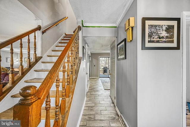 119 Birchside Cir, Locust Grove, VA 22508 - stairway with a textured ceiling, crown molding, wood finished floors, and baseboards