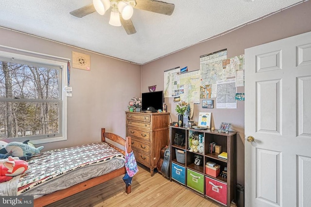 119 Birchside Cir, Locust Grove, VA 22508 - bedroom with wood finished floors, a textured ceiling, and a ceiling fan