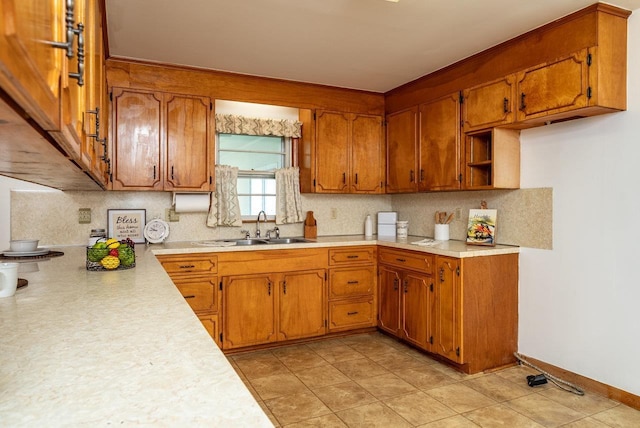 4490 N Valley Pike, Rockingham, VA 22802 - kitchen with brown cabinets, light countertops, and decorative backsplash