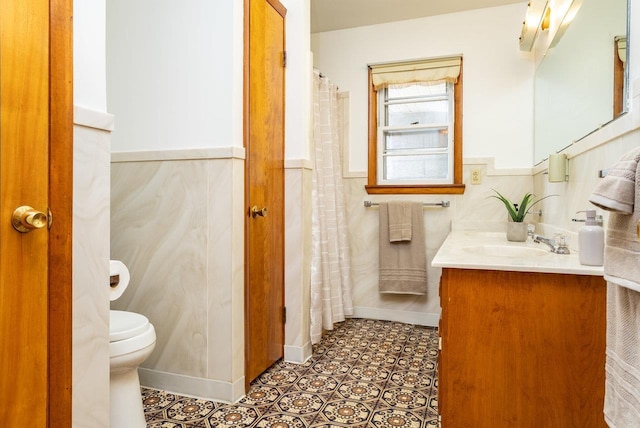 4490 N Valley Pike, Rockingham, VA 22802 - bathroom featuring vanity, a wainscoted wall, and curtained shower