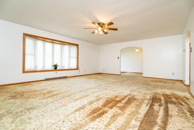 4490 N Valley Pike, Rockingham, VA 22802 - empty room with arched walkways, ceiling fan, and carpet