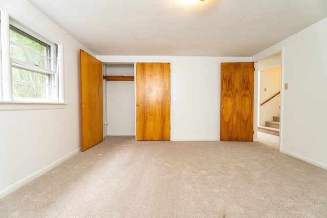 4490 N Valley Pike, Rockingham, VA 22802 - unfurnished bedroom with carpet, a textured ceiling, and a closet