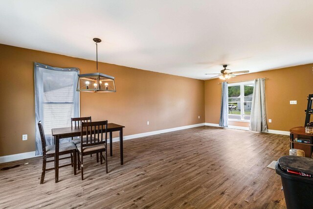 250 Washington Ave W, Elkton, VA 22827 - dining area with a chandelier, wood finished floors, ceiling fan, and baseboards