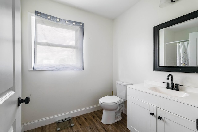 250 Washington Ave W, Elkton, VA 22827 - full bathroom featuring wood finished floors, toilet, vanity, and baseboards