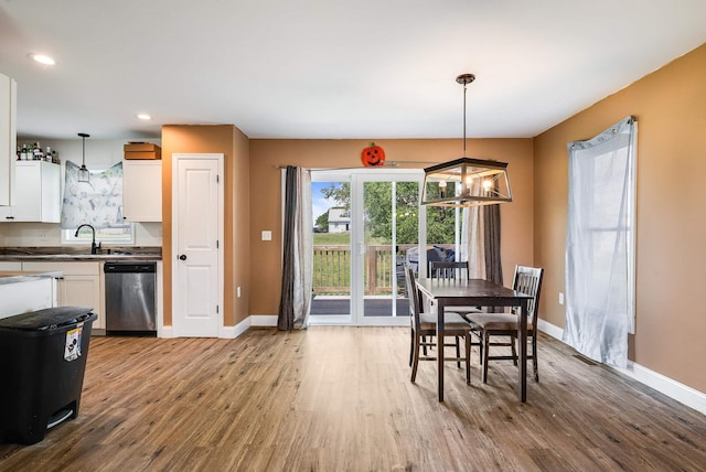 250 Washington Ave W, Elkton, VA 22827 - dining room featuring wood finished floors, a chandelier, baseboards, and recessed lighting