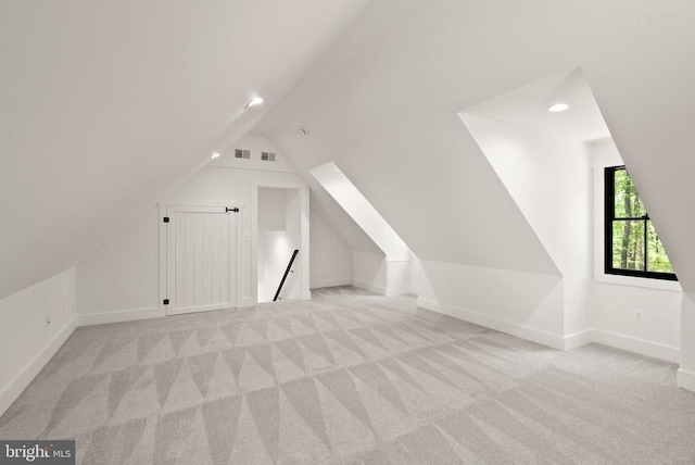  - bonus room featuring lofted ceiling, carpet, visible vents, and recessed lighting