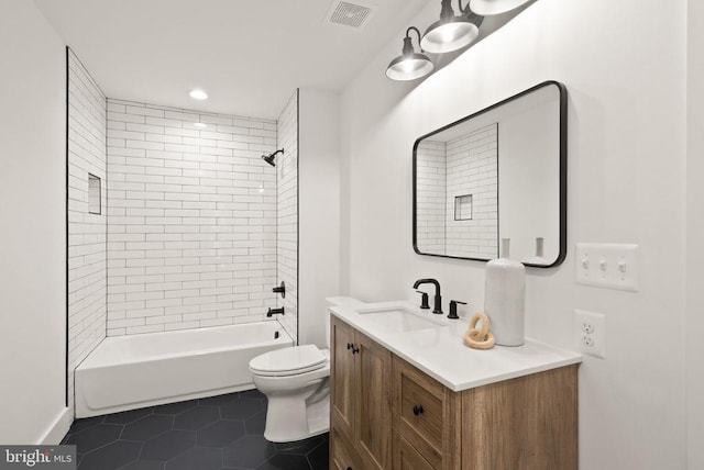  - full bath with toilet, vanity, visible vents, tile patterned floors, and washtub / shower combination