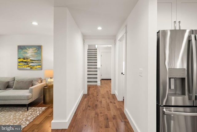  - hallway with stairs, wood finished floors, baseboards, and recessed lighting