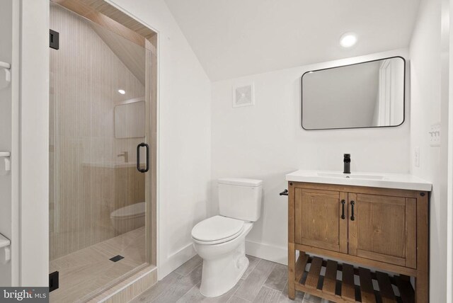  - full bathroom featuring toilet, a stall shower, visible vents, baseboards, and vanity