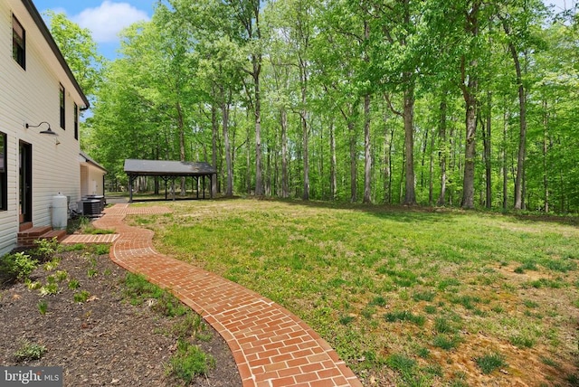  - view of yard featuring central air condition unit and a gazebo