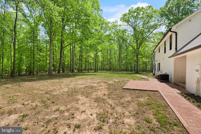  - view of yard featuring cooling unit and a wooden deck