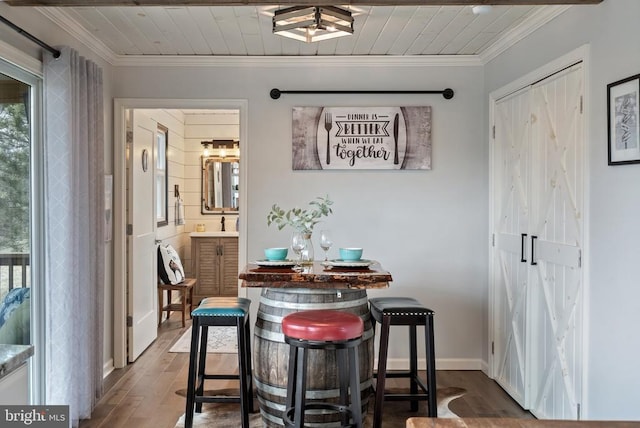 26438 Pennfields Dr, Orange, VA 22960 - dining room with baseboards, crown molding, and wood finished floors
