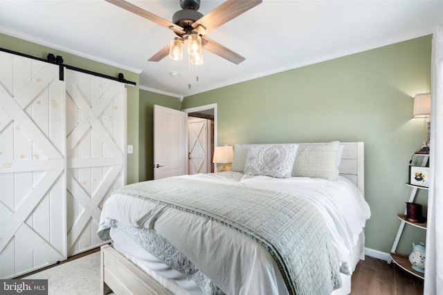 26438 Pennfields Dr, Orange, VA 22960 - bedroom with wood finished floors, crown molding, a barn door, baseboards, and ceiling fan