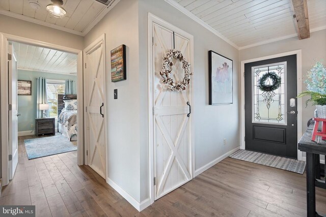 26438 Pennfields Dr, Orange, VA 22960 - foyer entrance featuring crown molding, wood ceiling, and hardwood / wood-style flooring