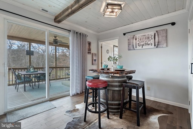 26438 Pennfields Dr, Orange, VA 22960 - dining space with hardwood / wood-style flooring, ornamental molding, visible vents, wood ceiling, and baseboards