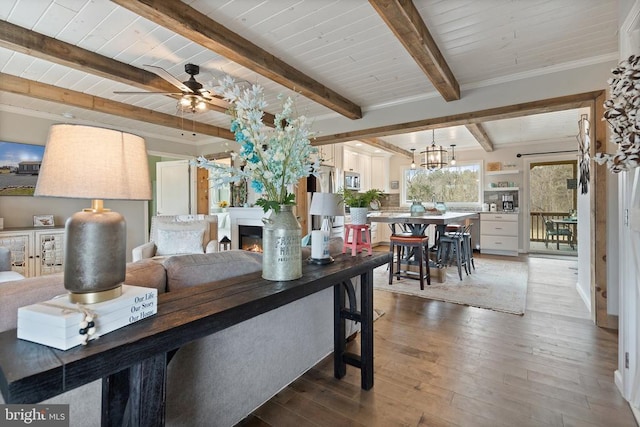 26438 Pennfields Dr, Orange, VA 22960 - interior space with hardwood / wood-style flooring, a warm lit fireplace, ceiling fan with notable chandelier, beam ceiling, and wooden ceiling