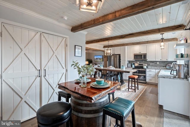 26438 Pennfields Dr, Orange, VA 22960 - dining space featuring beam ceiling, wood ceiling, and light wood-style floors