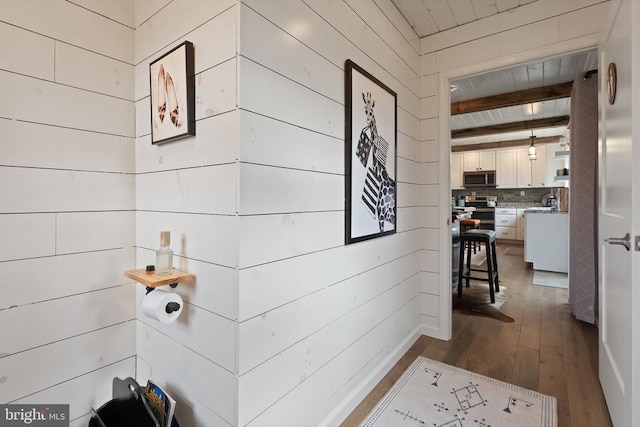 26438 Pennfields Dr, Orange, VA 22960 - hallway featuring dark wood-type flooring, wood walls, and beamed ceiling