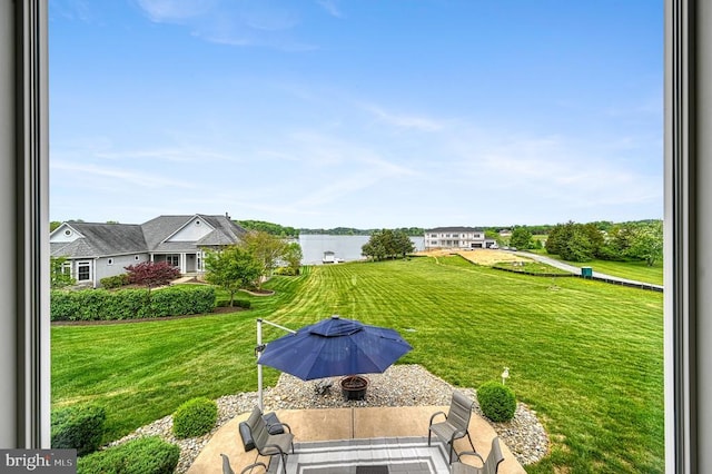 79 Carrie Ct, Mineral, VA 23117 - view of green lawn with a water view and a patio area