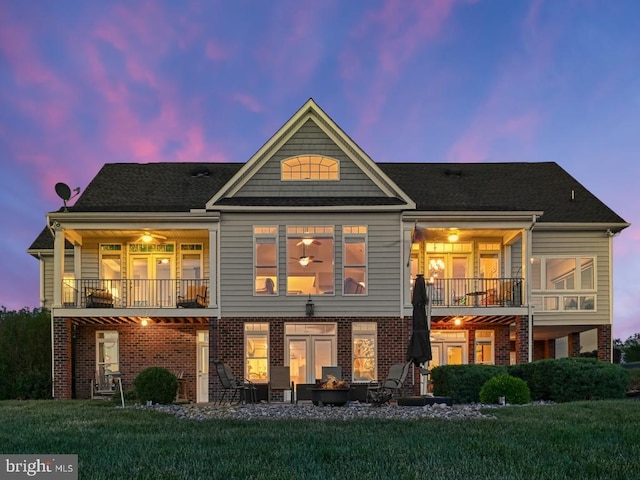 79 Carrie Ct, Mineral, VA 23117 - back of house with a balcony, a yard, brick siding, and a patio area