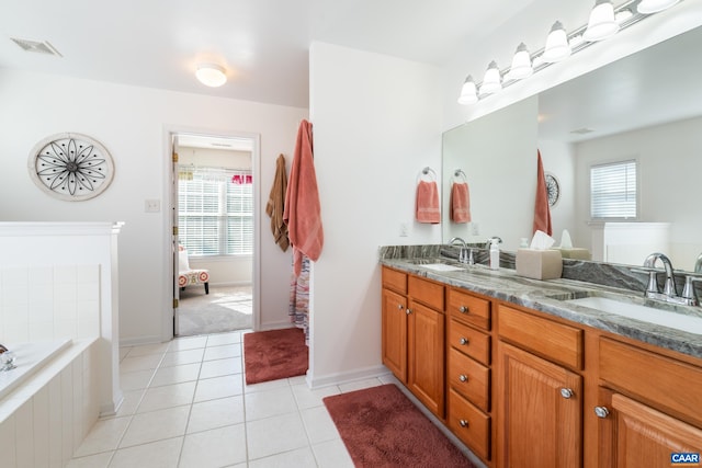 353 Bayberry Way, Charlottesville, VA 22911 - full bath featuring double vanity, plenty of natural light, tile patterned floors, and a relaxing tiled tub