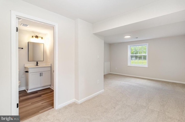 8452 Turnbull Rd, Warrenton, VA 20186 - unfurnished room with light colored carpet, baseboards, and a sink