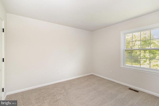 8452 Turnbull Rd, Warrenton, VA 20186 - unfurnished room with carpet floors, baseboards, and healthy amount of natural light