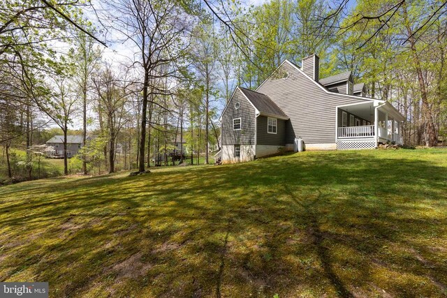 372 Daniels Rd, Barboursville, VA 22923 - view of home's exterior with a chimney, a lawn, and a porch