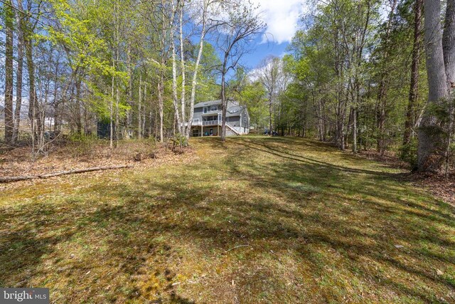 372 Daniels Rd, Barboursville, VA 22923 - view of grassy yard featuring stairs and a wooded view
